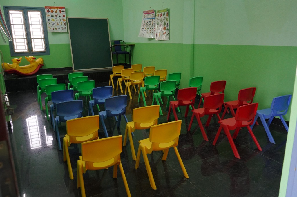 Vikas School Nursery KG Classroom – colourful chairs, activity posters, play zone
